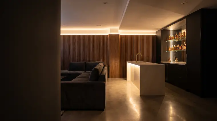 Design concept: a basement lounge with a walnut feature wall and wet bar