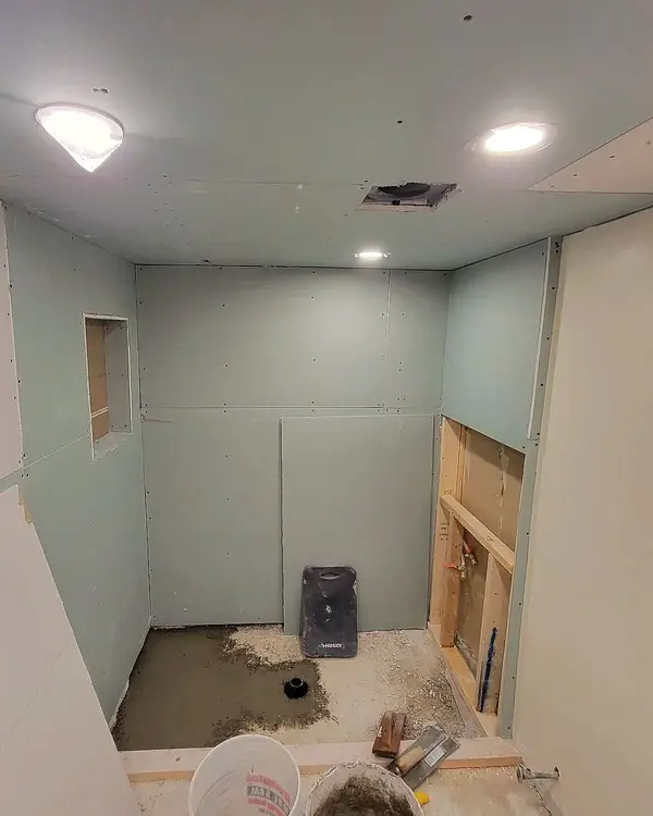 Stage 1: the basement bathroom with walls closed in, before waterproofing